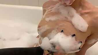 Watch A Teen'S Small Tits Bob In A Bubble Bath