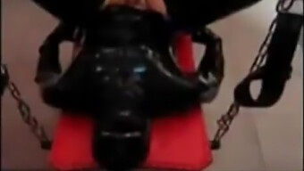 Latex-Clad Submissive Takes A Strapon In Mouth And Ass