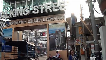 Asian Tourist Enjoys Street Day In Thailand